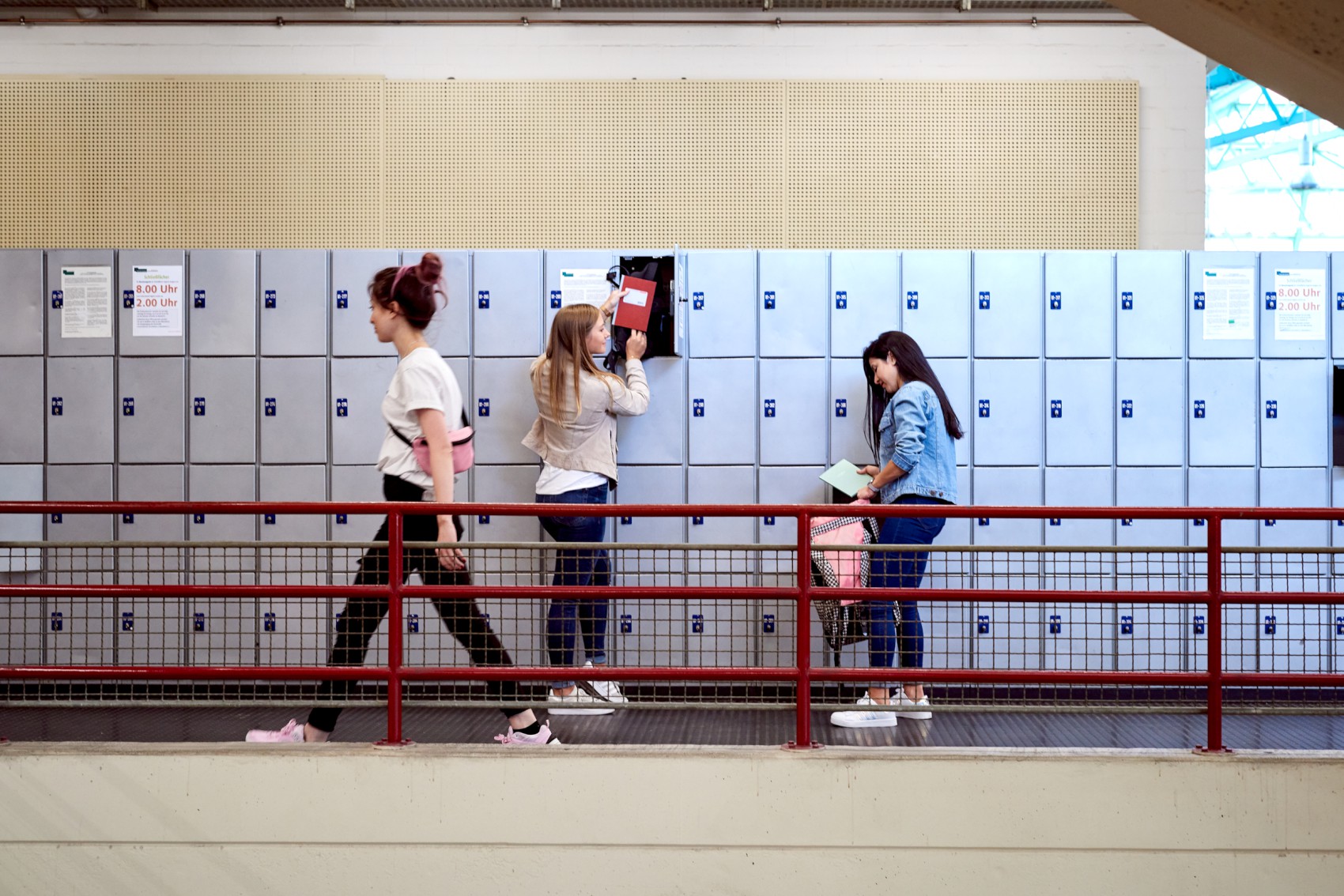 students in front of lockers